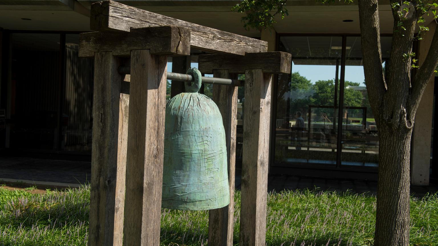 Bronze bell sculpture entitled "Barcelona" by Toshiko Takaezu outside the Robert Wood Johnson Medical School on Busch campus
