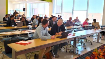 Attendees talk during a research ideation forum on machine learning and artificial intelligence