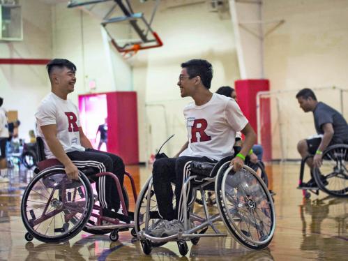 Students in wheelchairs on the court